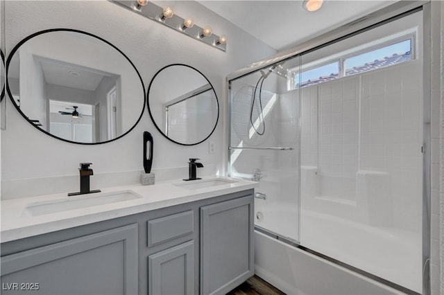 bathroom with enclosed tub / shower combo and vanity