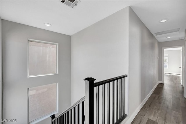 hall with hardwood / wood-style floors