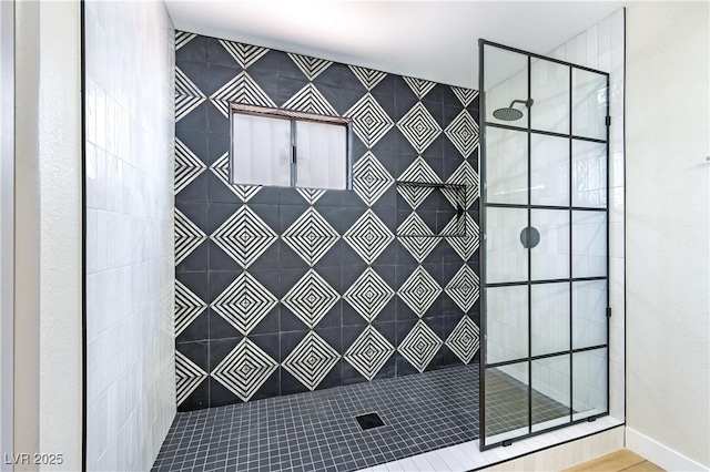 full bathroom with tiled shower