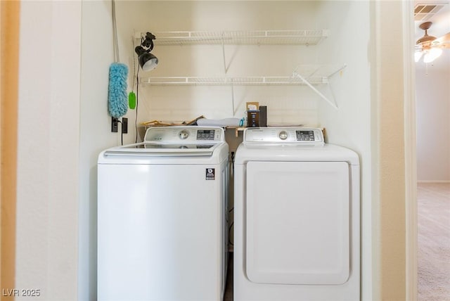 clothes washing area featuring independent washer and dryer