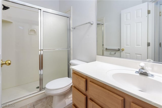 bathroom with toilet, tile patterned flooring, an enclosed shower, and vanity