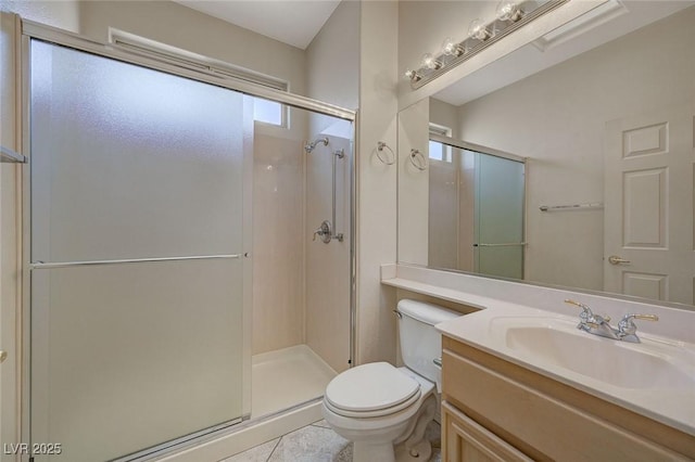 bathroom featuring toilet, a healthy amount of sunlight, and walk in shower