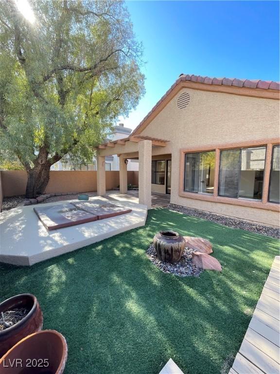 exterior space with a patio and a fire pit