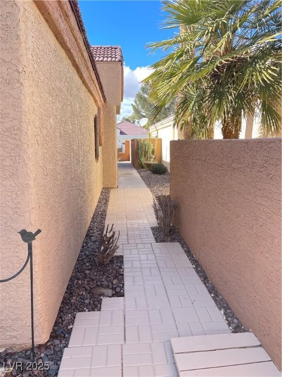 view of side of property with a patio area