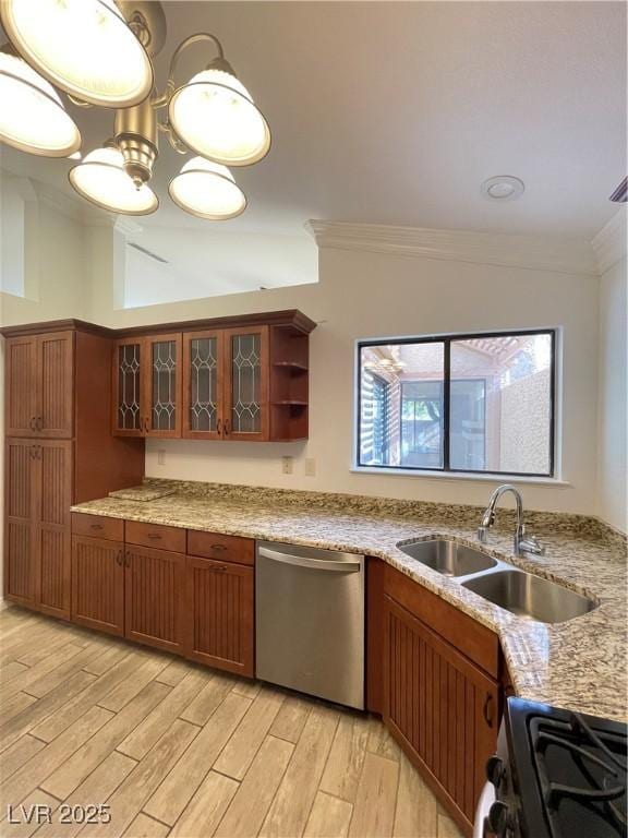 kitchen featuring sink, range, vaulted ceiling, stainless steel dishwasher, and ornamental molding