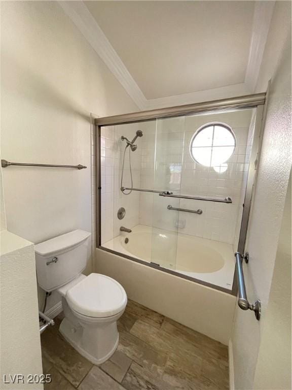 bathroom with bath / shower combo with glass door, crown molding, and toilet