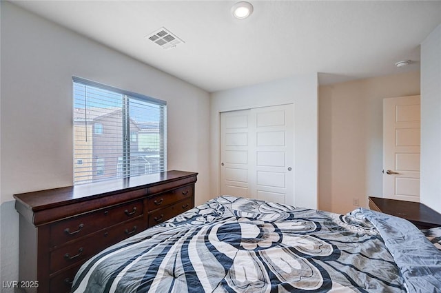 bedroom featuring a closet and visible vents