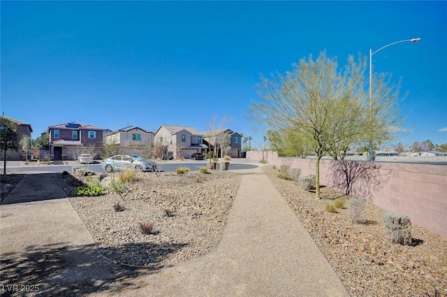 exterior space with a residential view and fence