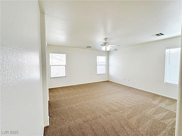 11036 Parete Ct, Las Vegas, NV 89141 - unfurnished room featuring ceiling fan, carpet, and a textured ceiling