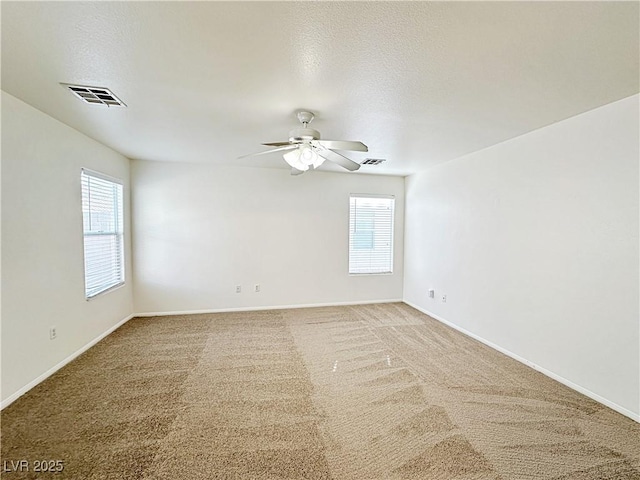 11036 Parete Ct, Las Vegas, NV 89141 - empty room with ceiling fan, light colored carpet, and a textured ceiling