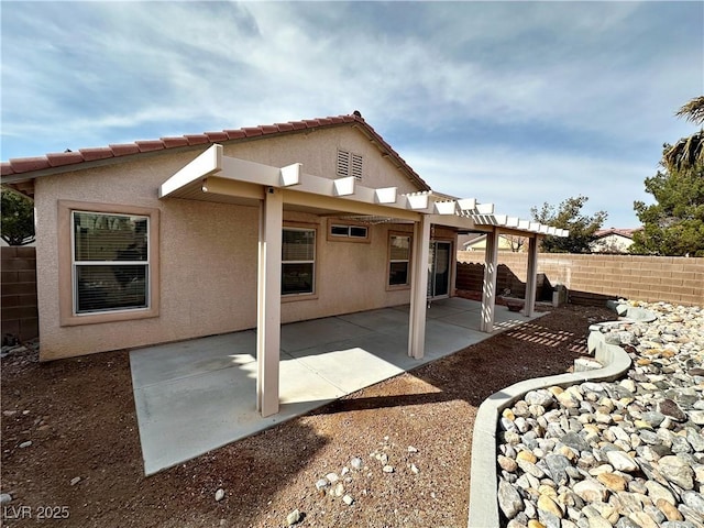 11036 Parete Ct, Las Vegas, NV 89141 - back of property with stucco siding and a patio