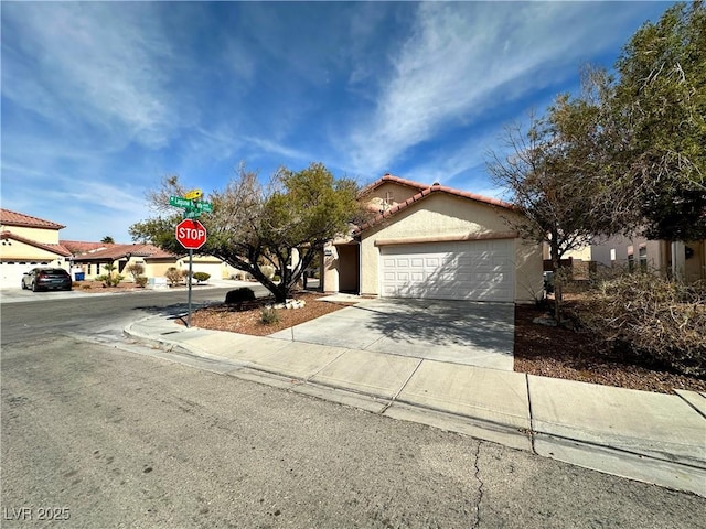 11036 Parete Ct, Las Vegas, NV 89141 - view of front of house featuring driveway, a tiled roof, a garage, and stucco siding