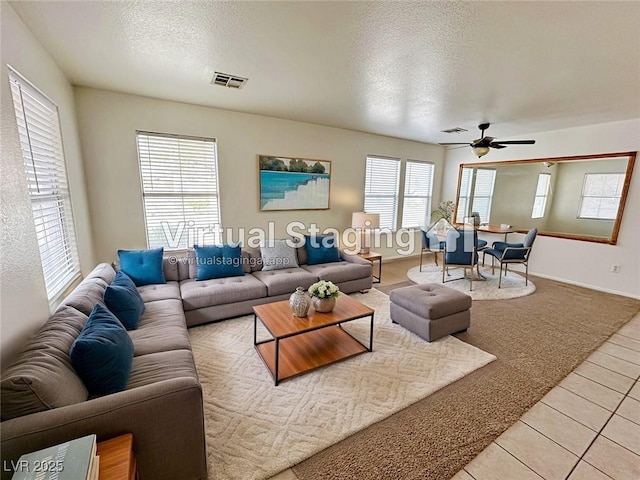 11036 Parete Ct, Las Vegas, NV 89141 - living area with a textured ceiling, light tile patterned floors, and ceiling fan
