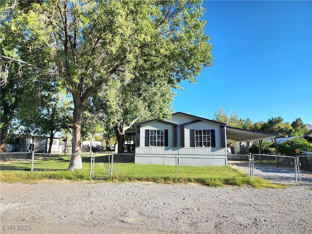 view of front of property with a carport and a front yard