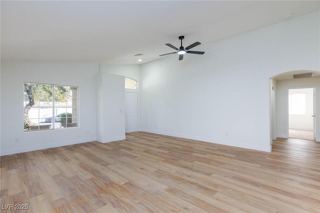 unfurnished room featuring vaulted ceiling, light hardwood / wood-style floors, and ceiling fan