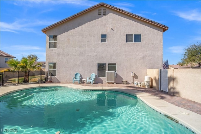 view of pool featuring a fenced in pool, a patio, and fence