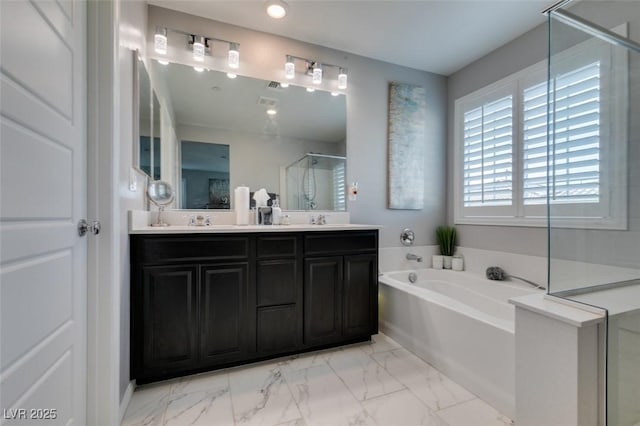 3192 Bormida Ave, Henderson, NV 89044 - full bath with a shower stall, double vanity, marble look tiles, a garden tub, and recessed lighting
