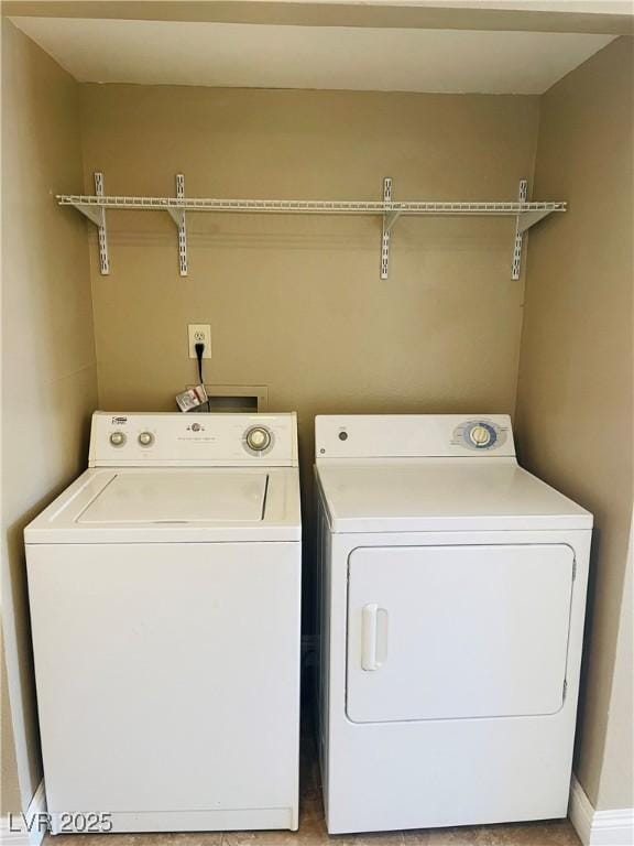 washroom featuring laundry area and washer and dryer