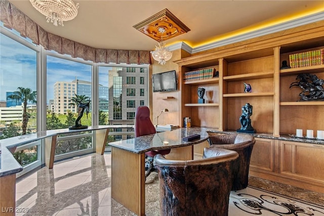 home office featuring an inviting chandelier and granite finish floor