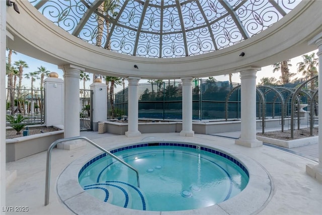 view of pool featuring a hot tub, a patio, and fence