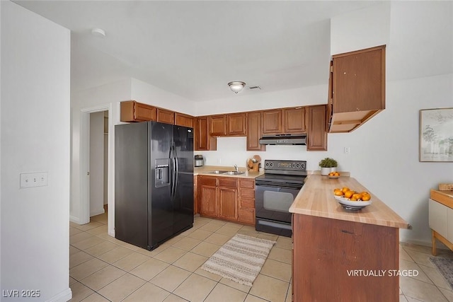 kitchen with light tile patterned floors, kitchen peninsula, sink, and black appliances