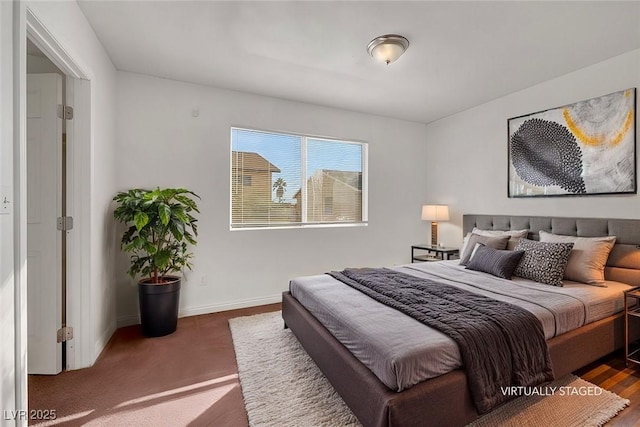 bedroom with dark carpet