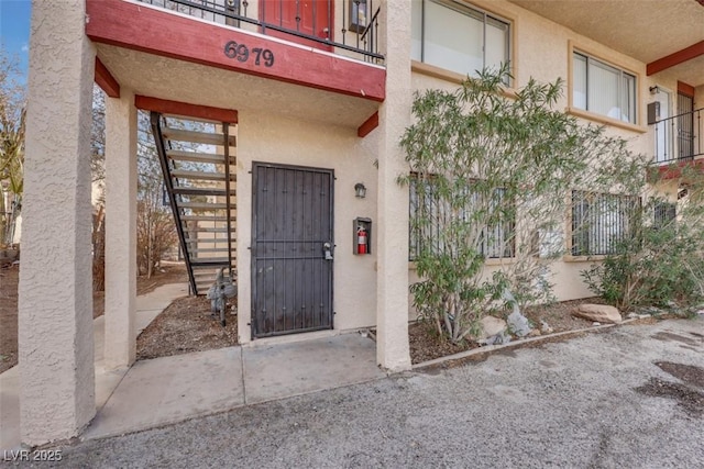 entrance to property with a balcony