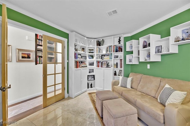 interior space featuring ornamental molding and french doors