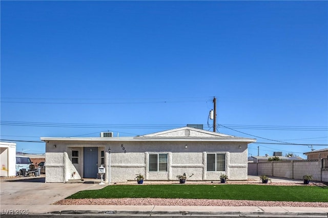 view of front facade with central AC and a front yard