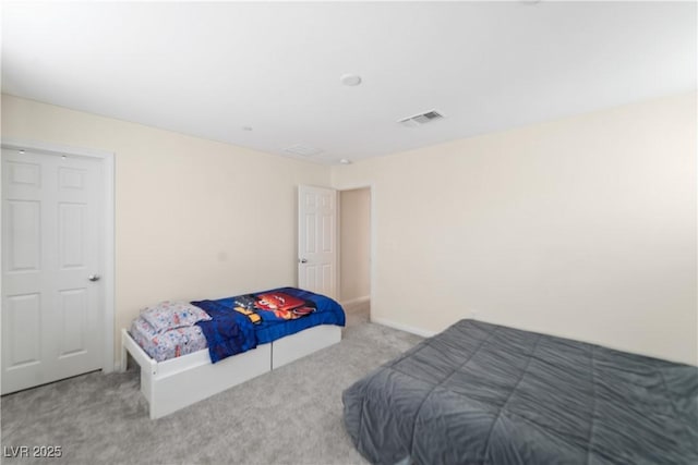 bedroom with light carpet