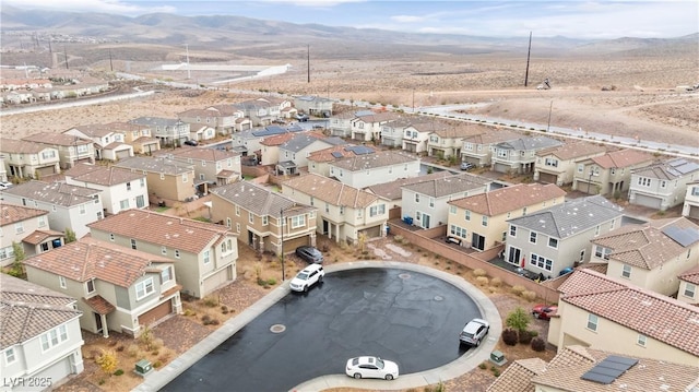 drone / aerial view featuring a mountain view