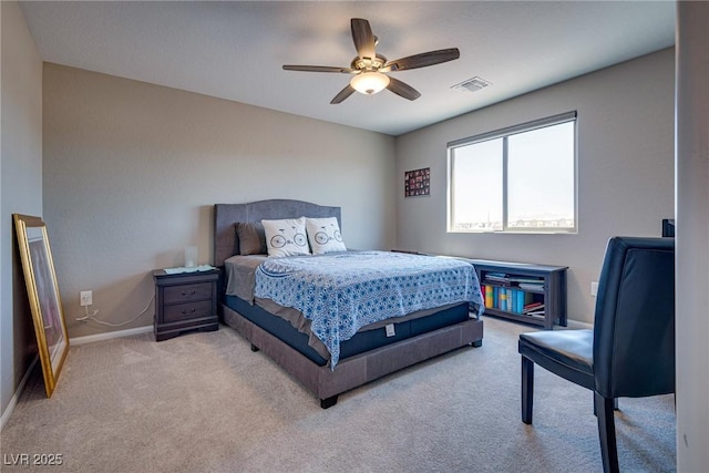 bedroom with ceiling fan and light colored carpet