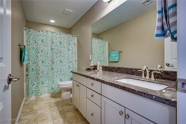 full bathroom featuring toilet, vanity, and shower / bath combination with curtain