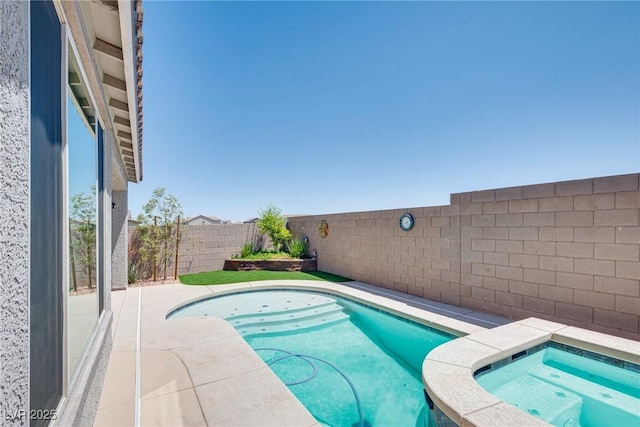 view of pool featuring a patio and an in ground hot tub