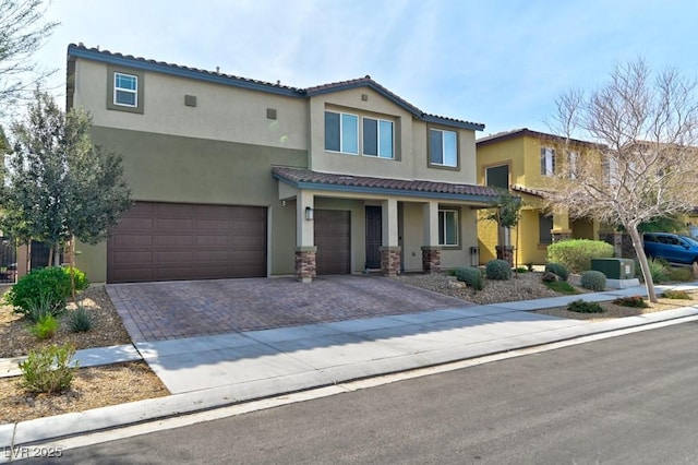 mediterranean / spanish home featuring cooling unit and a garage