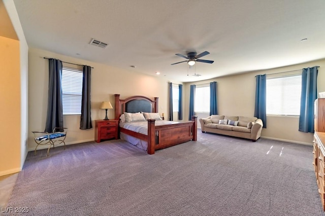 bedroom with ceiling fan and carpet floors