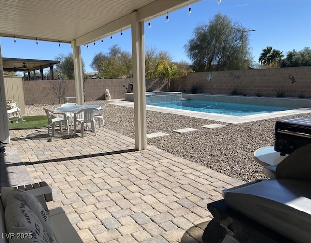 view of swimming pool featuring a patio area