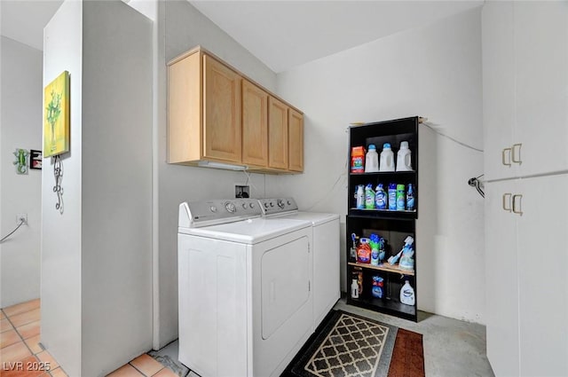 clothes washing area with cabinet space and independent washer and dryer