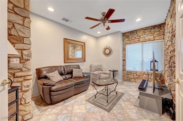 living room with ceiling fan, visible vents, and recessed lighting