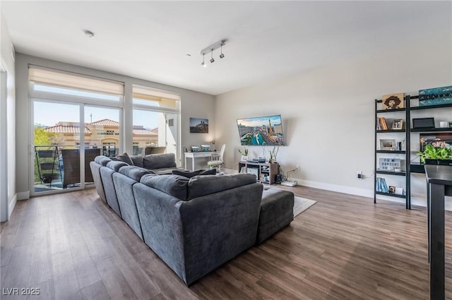 living room featuring hardwood / wood-style floors and rail lighting