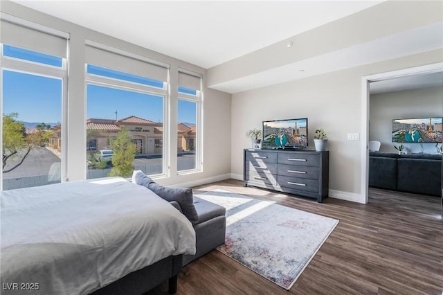 bedroom featuring dark hardwood / wood-style flooring