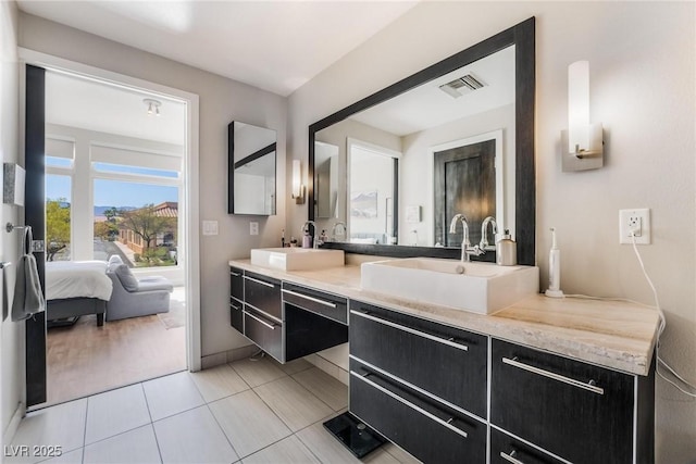 bathroom featuring vanity and tile patterned flooring