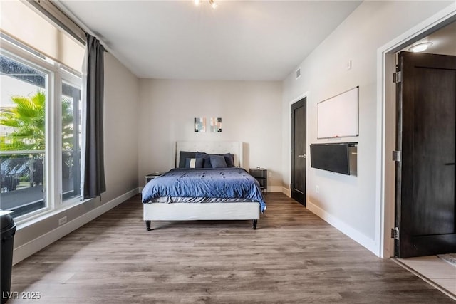 bedroom featuring hardwood / wood-style floors