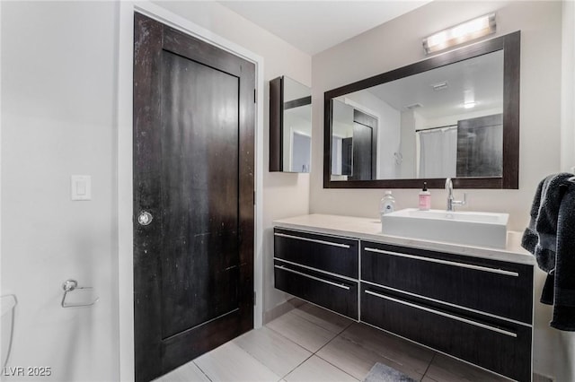 bathroom with vanity, tile patterned flooring, and curtained shower