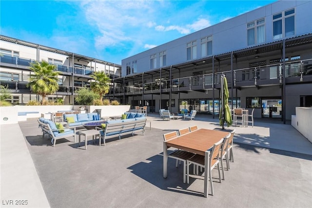 view of home's community with outdoor lounge area