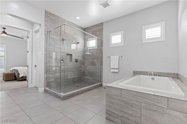 bathroom featuring ceiling fan, plenty of natural light, tile patterned flooring, and shower with separate bathtub