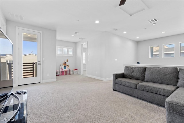 living room featuring light carpet