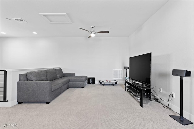 carpeted living room with ceiling fan