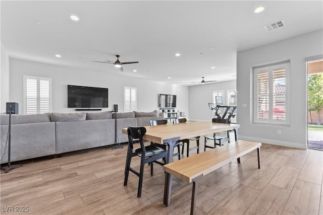 dining space featuring ceiling fan and light hardwood / wood-style flooring