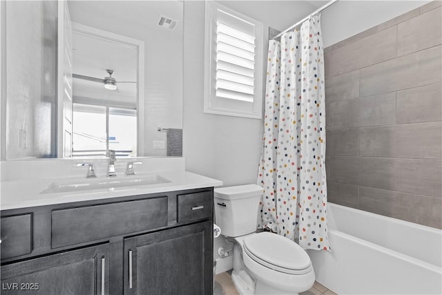 full bathroom featuring toilet, vanity, and shower / tub combo